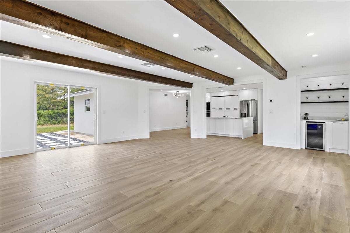 Great room, empty vs. virtually staged before